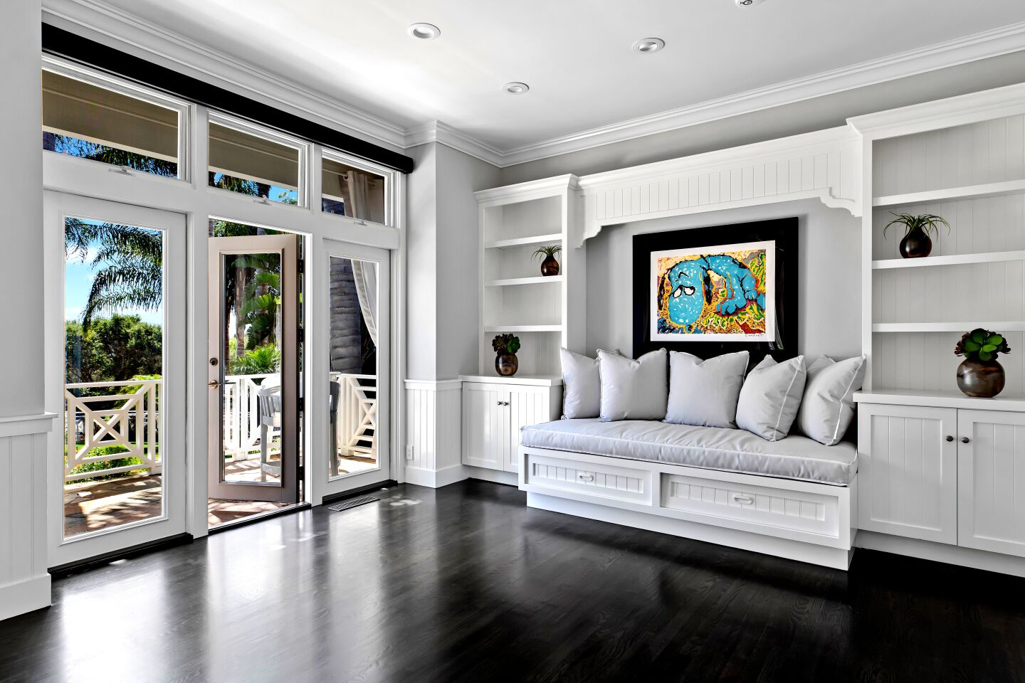 Crisp white millwork, dark hardwood floors and light gray hues give the interior a calming feel.