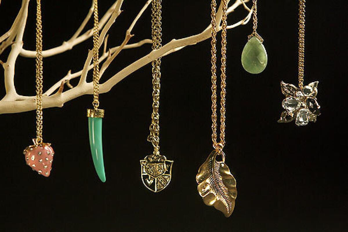 Strawberry pendant with rhinestone seeds, left, $6.80; faux horn pendant, $5.80; heraldic pendant, $6.80; leaf pendant, $2.99; jade drop, $5.80; vintage jeweled pendant, $4.80.