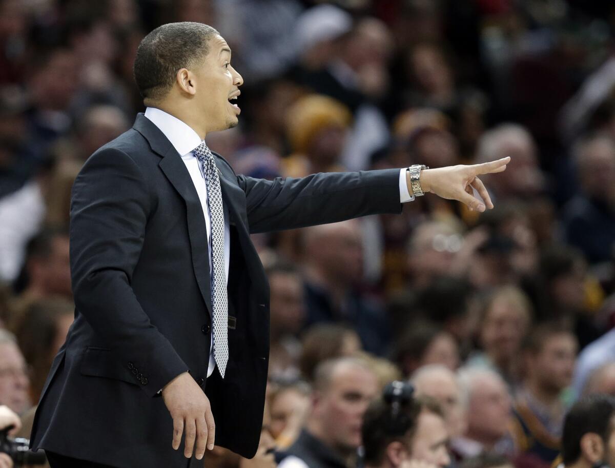 Cavaliers Coach Tyronn Lue yells to players in the second half of Cleveland's 114-107 win over the Timberwolves.