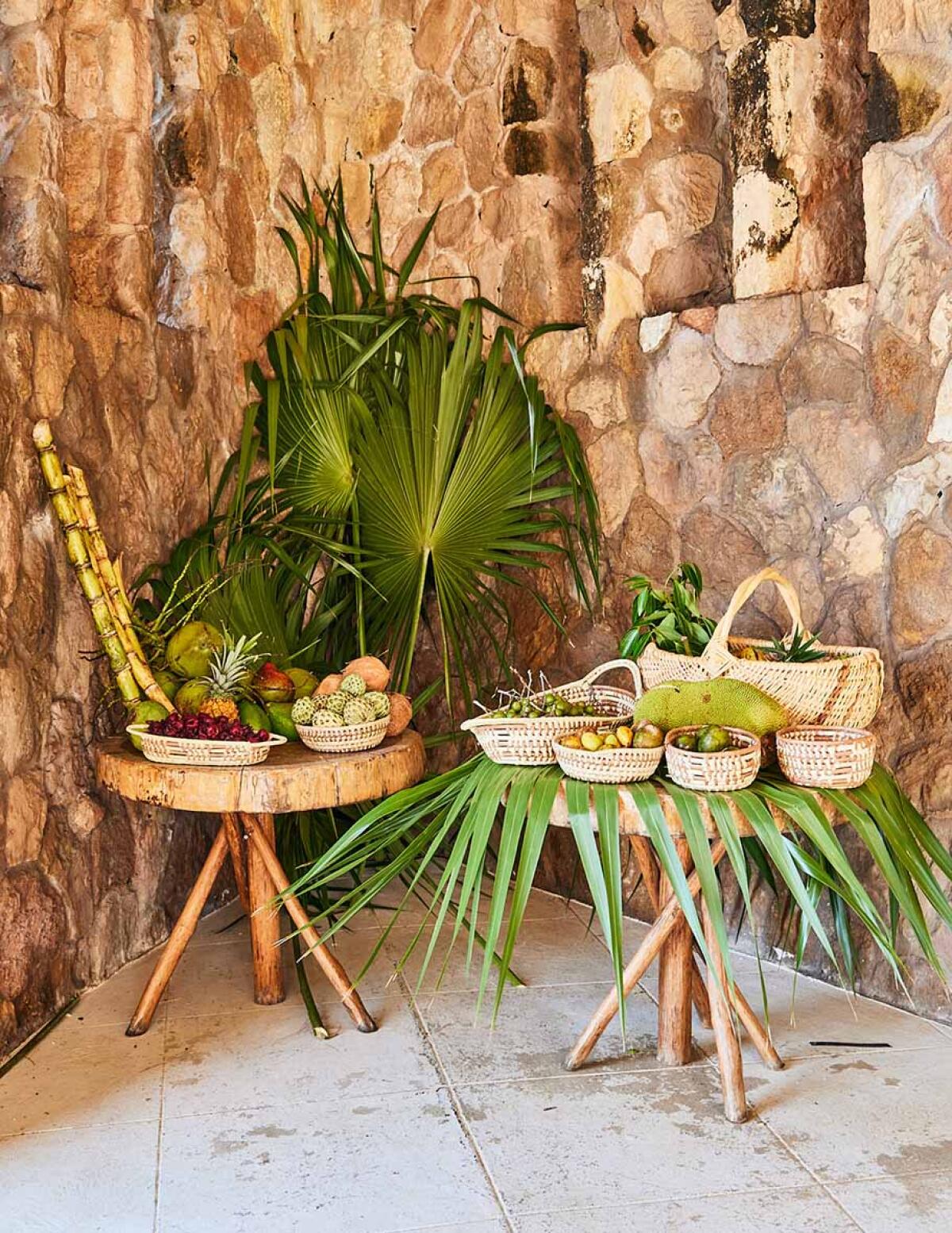 A fruit stand functions as wedding decor.