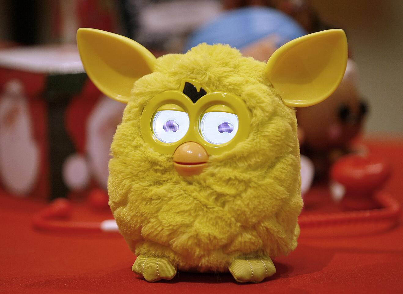 The new Furby toy from the Toys R Us pop up store at the Glendale Galleria was highlighted during holiday press conference at the Glendale indoor mall on Tuesday, Nov. 13, 2012. Furby, at a cost of $54, comes in six colors, can interact with other Furbys and according to a press release, is "emotional and unpredictable."