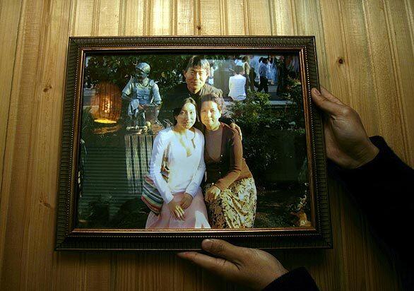 Jong Pil Yun, in a photo with his wife Chuneui and their daughter, was shot in the chest but is expected to survive.
