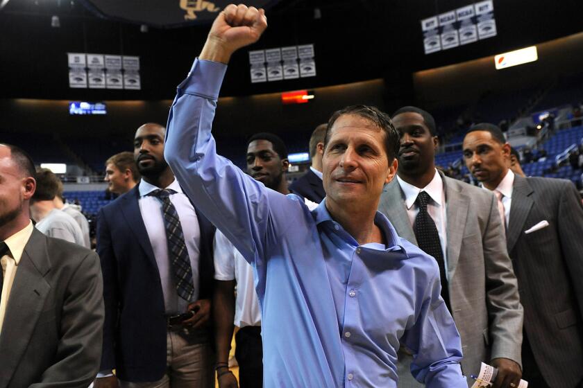 Nevada Coach Eric Musselman celebrates after the Wolf Pack won their CBI tournament opener against Montana on March 16. Nevada won the title on Friday.