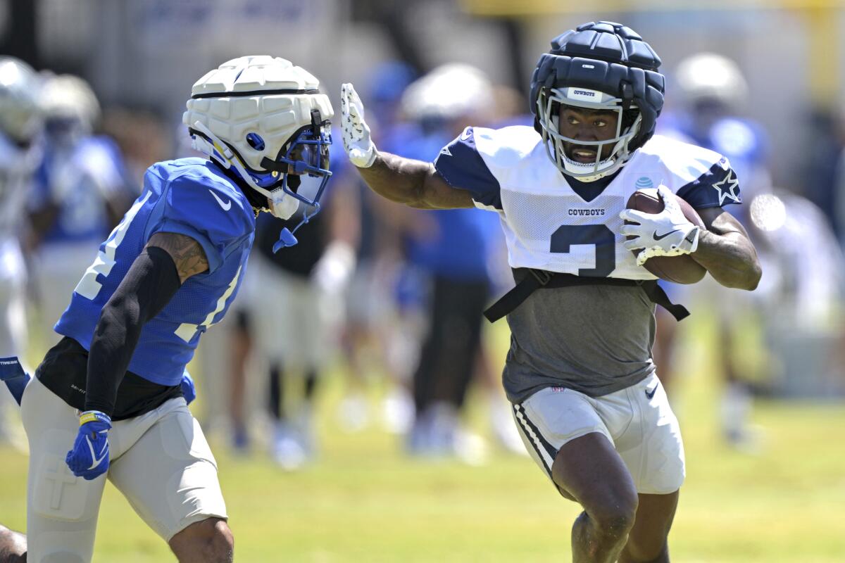 Rams cornerback Cobie Durant (left) defends against Cowboys receiver Brandin Cooks during a joint practice.