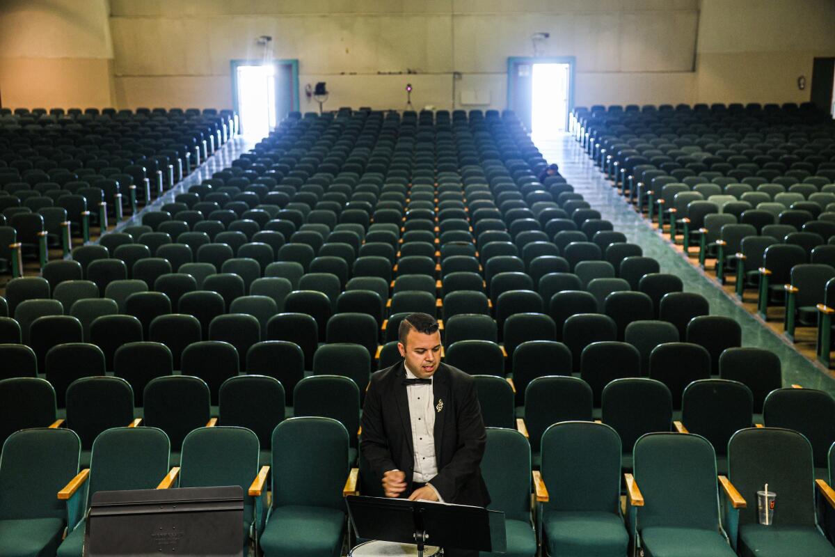  Inglewood High School band director Joseph Jauregui prepares for a concert at the school.