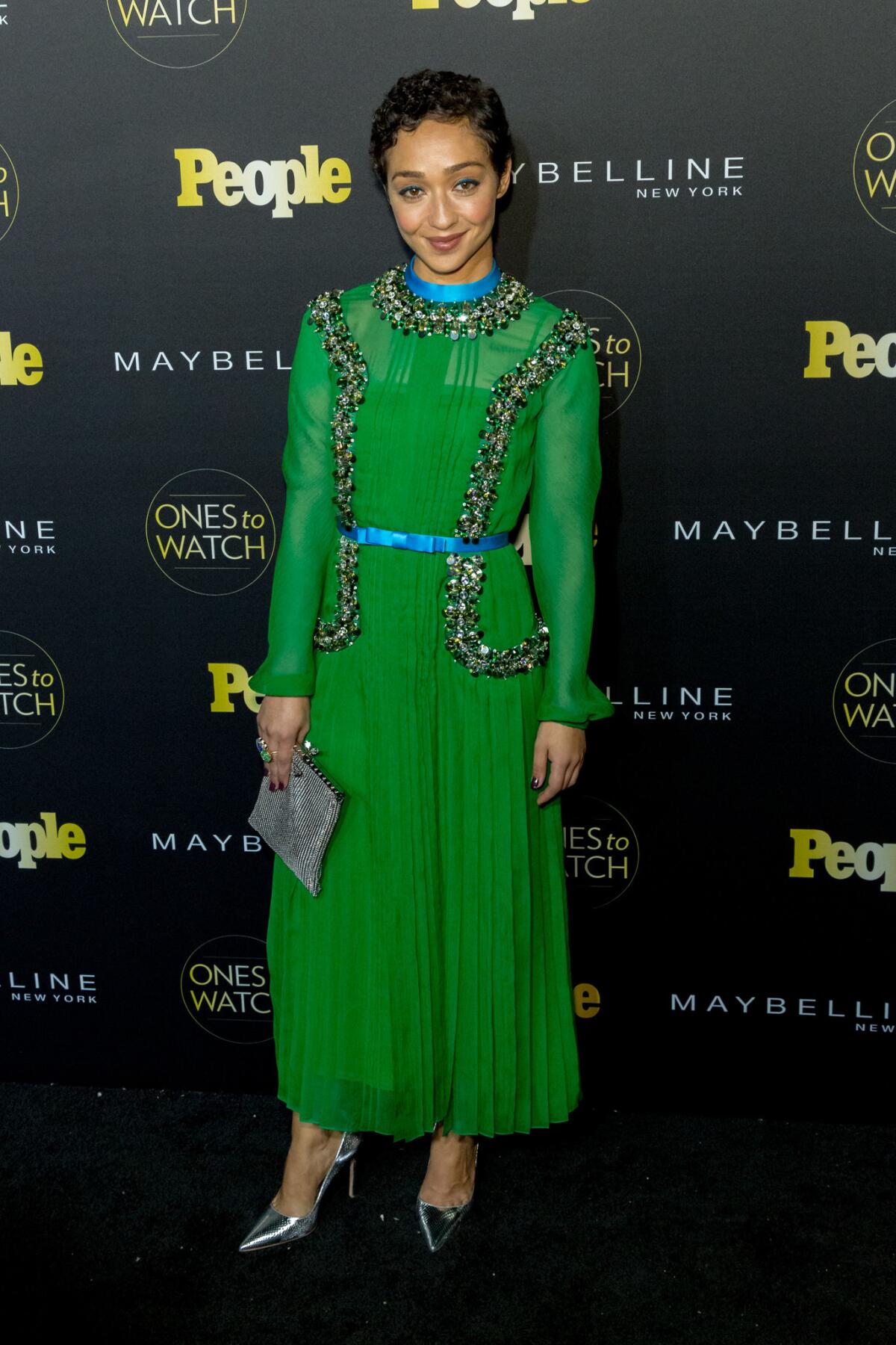 An emerald Prada gown’s unusual trimming highlights Negga’s blend of strength and delicacy. (Greg Doherty / Getty Images)