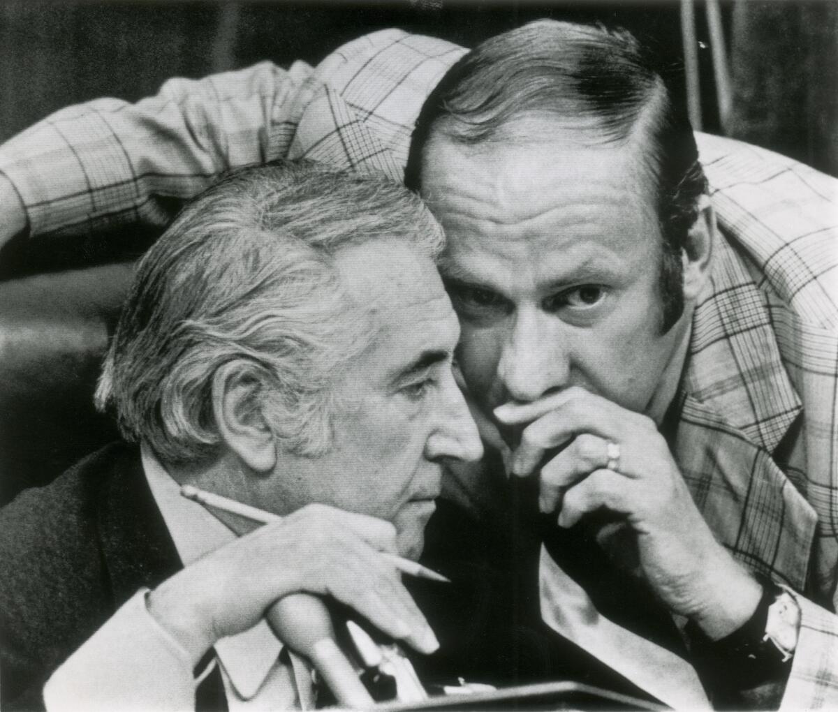 Rep. Thomas Railsback (R-Ill.), right, confers with House Judiciary Committee Chairman Peter Rodino (D-N.J.) during the committee's debate on articles of impeachment against President Nixon in 1974.