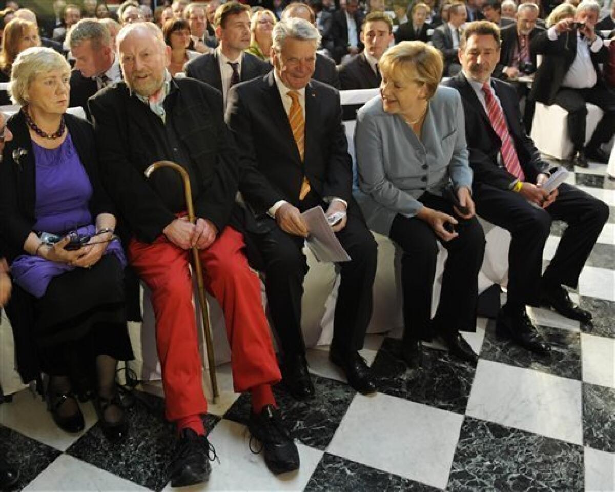 Danish cartoonist Kurt Westergaard, second from left, and his wife Gitte, left, speak with German Chancellor Angela Merkel (second right), the Mayor of Potsdam Jann Jakobs, right, and Joachim Gauck, former head of the state-funded body which manages the archives of the former East German secret police Stasi, before receiving the M100 Media Prize 2010 in Potsdam near Berlin, eastern Germany, Wednesday, Sept 8, 2010. Westergaard drew the most controversial of 12 caricatures of the Prophet Mohammed, first published in a Danish newspaper in 2005, which many Muslims considered offensive. (AP Photo/Odd Andersen, pool)