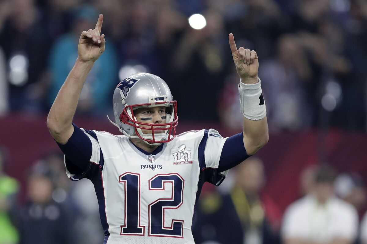 New England Patriots quarterback Tom Brady celebrates in the second half of a 34-28 overtime win.