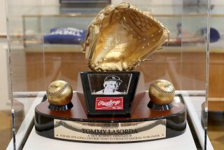 FULLERTON, CA - September 13: A 2011 Rawlings Heart of Gold award was given to Tommy Lasorda for his life-long contributions to promote baseball worldwide on display during OPicturing AmericaOs Pastime,O an exhibit at Fullerton Museum Center. (Kevin Chang / TimesOC)