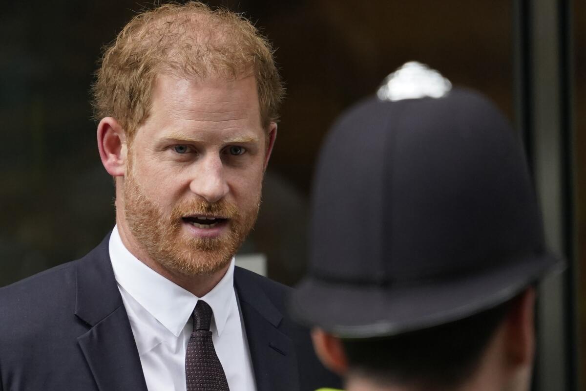 Britain's Prince Harry leaving a courthouse