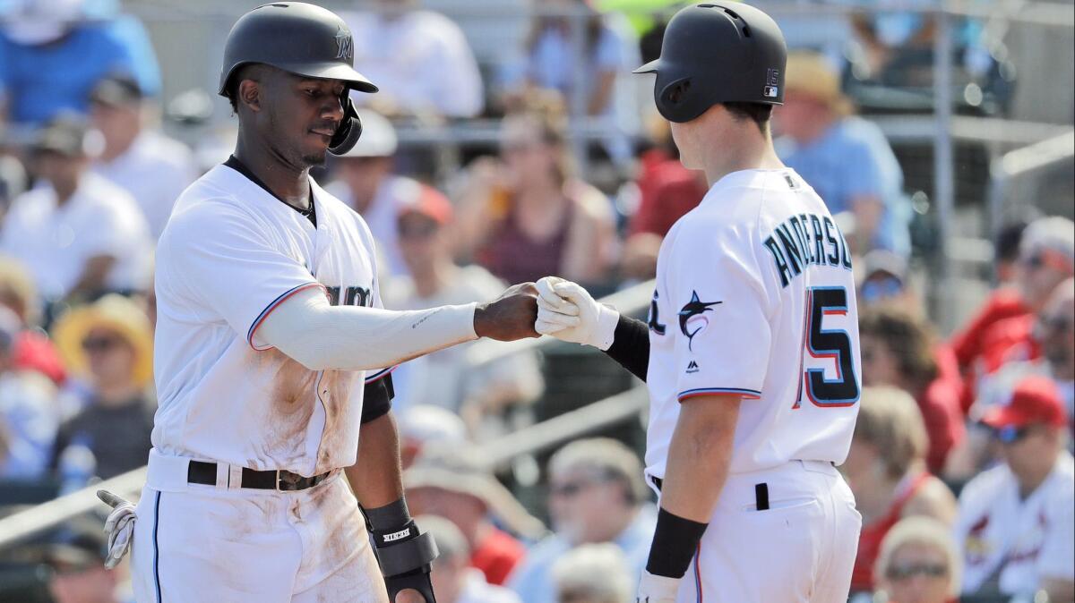 Miami Marlins chief executive officer Derek Jeter looks around as