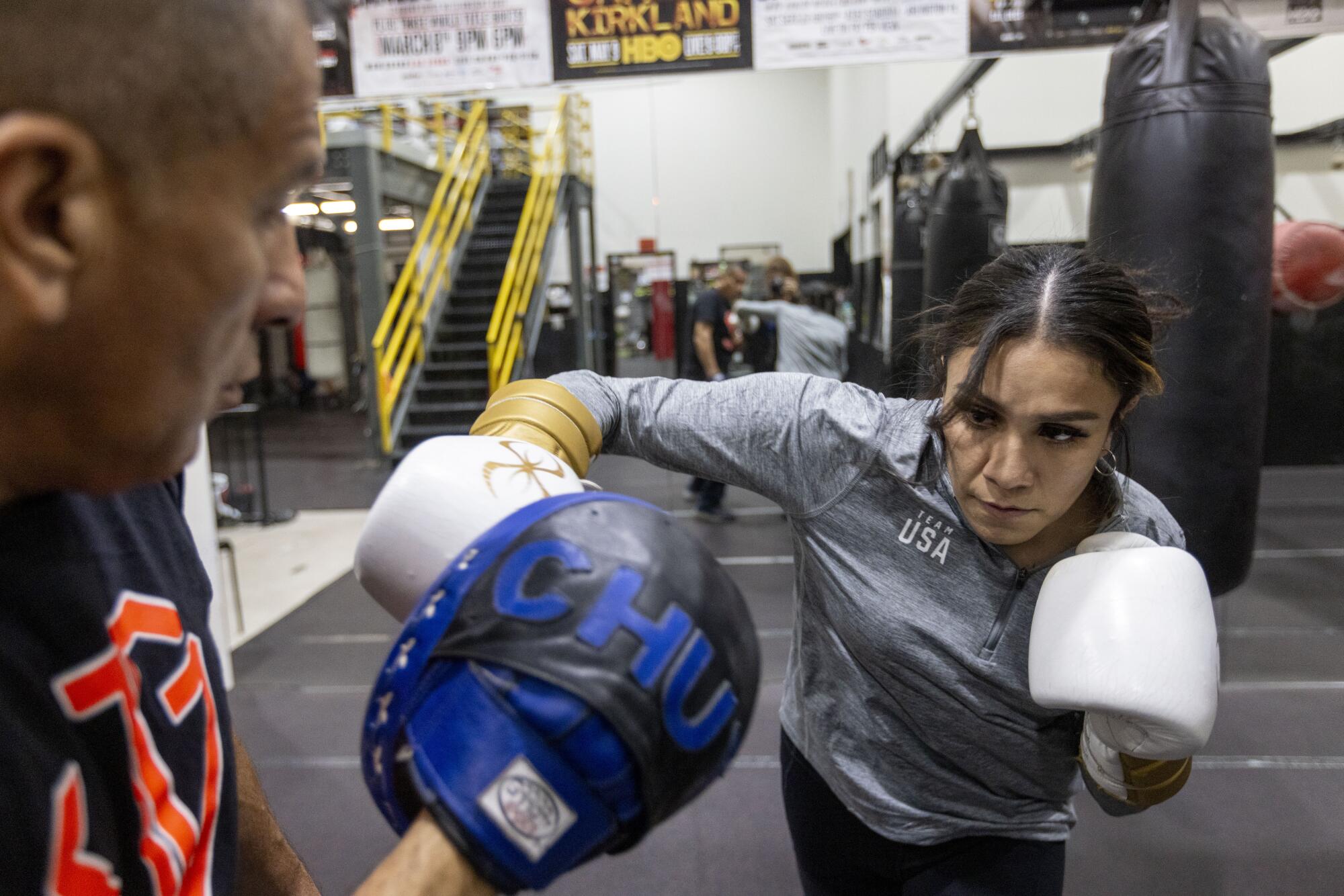 Jajaira Gonzalez trains with her father, Jose "Chuy" Gonzalez, at the CAPE Fitness gym in La Verne.