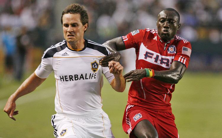 LA Galaxy's Todd Dunivant, left, and Chicago Fire's Dominic Oduro fight for the ball during a game at Home Depot Center in Carson on Saturday, July 9, 2011.
