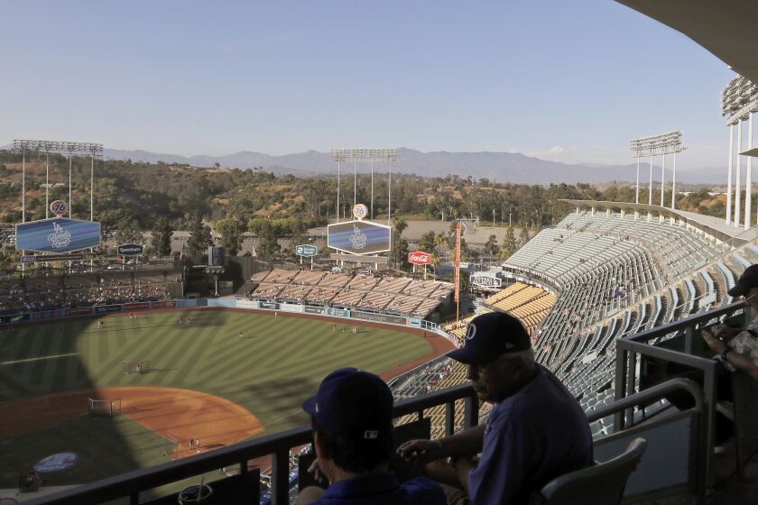 LOS ANGELES, CALIF. - AUG. 6, 2019. Baseball fans come early to watch the St. Louis Cardinals take batting practice before a game against the Dodgers on Tuesday, Aug. 6, 2019, at Dodger Stadium in Los Angeles. (Luis Sinco/Los Angeles Times)