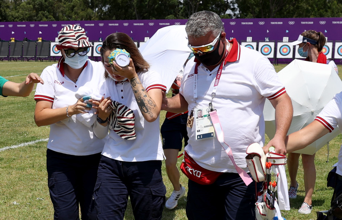 ROC archer Svetlana Gomboeva is treated for heat exhaustion at the Olympic Games on July 23. 
