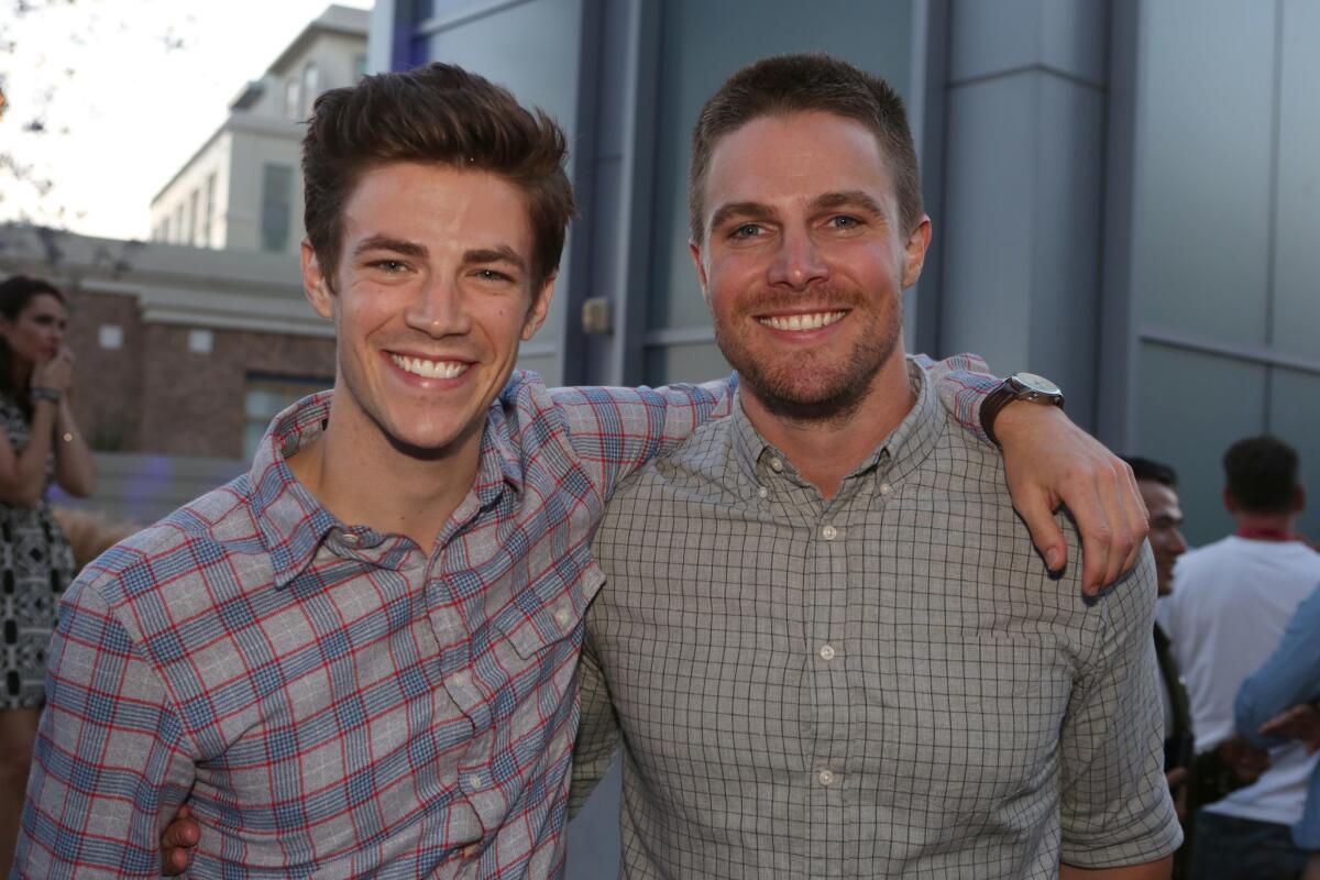 "The Flash" star Grant Gustin, left, and "Arrow" star Stephen Amell