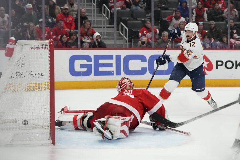 Florida Panthers center Eric Staal (12) shoots the puck past Detroit Red Wings goaltender Ville Husso during the third period of an NHL hockey game, Monday, March 20, 2023, in Detroit. (AP Photo/Carlos Osorio)