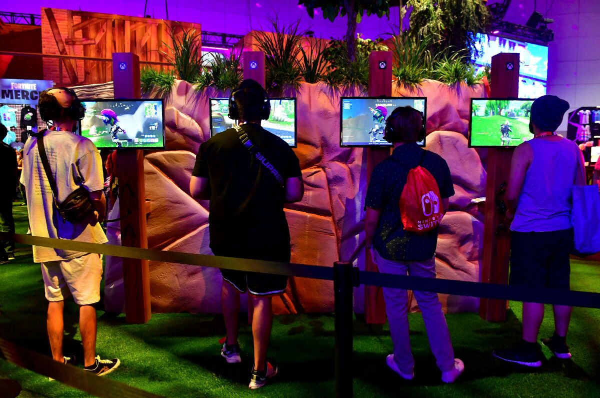 Fans play "Fortnite" at the 2018 Electronic Entertainment Expo at the Los Angeles Convention Center.