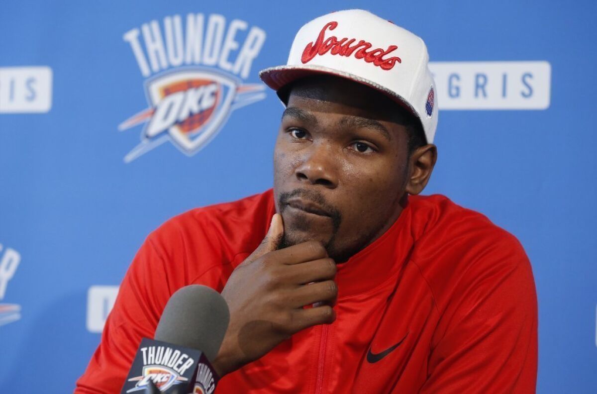 Oklahoma City Thunder forward Kevin Durant listens to a question during a news conference.
