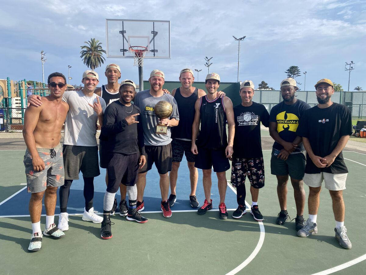 Members of the winning team of the 2021 Sneaks Summer Classic pose with Tyson Youngs (left) and Sawsun Khodopanah (right).