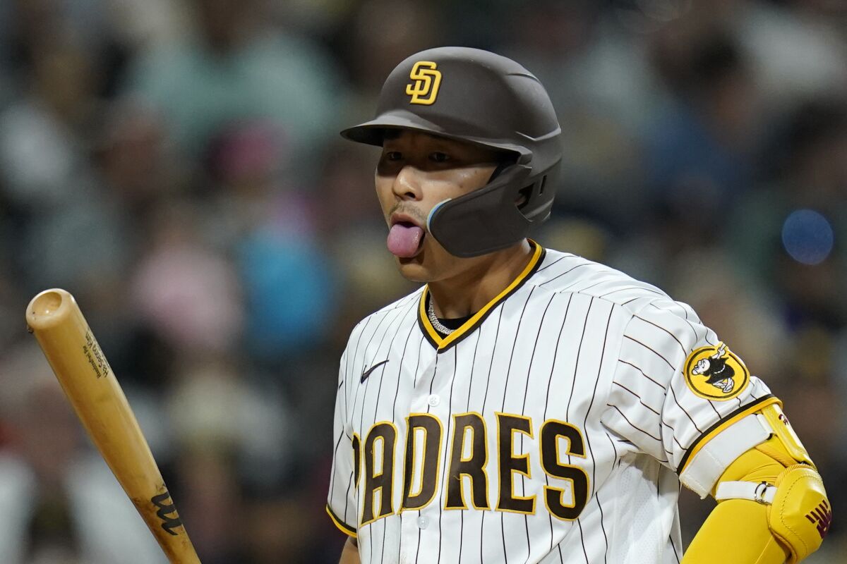 The Padres' Ha-Seong Kim reacts after a called strike 