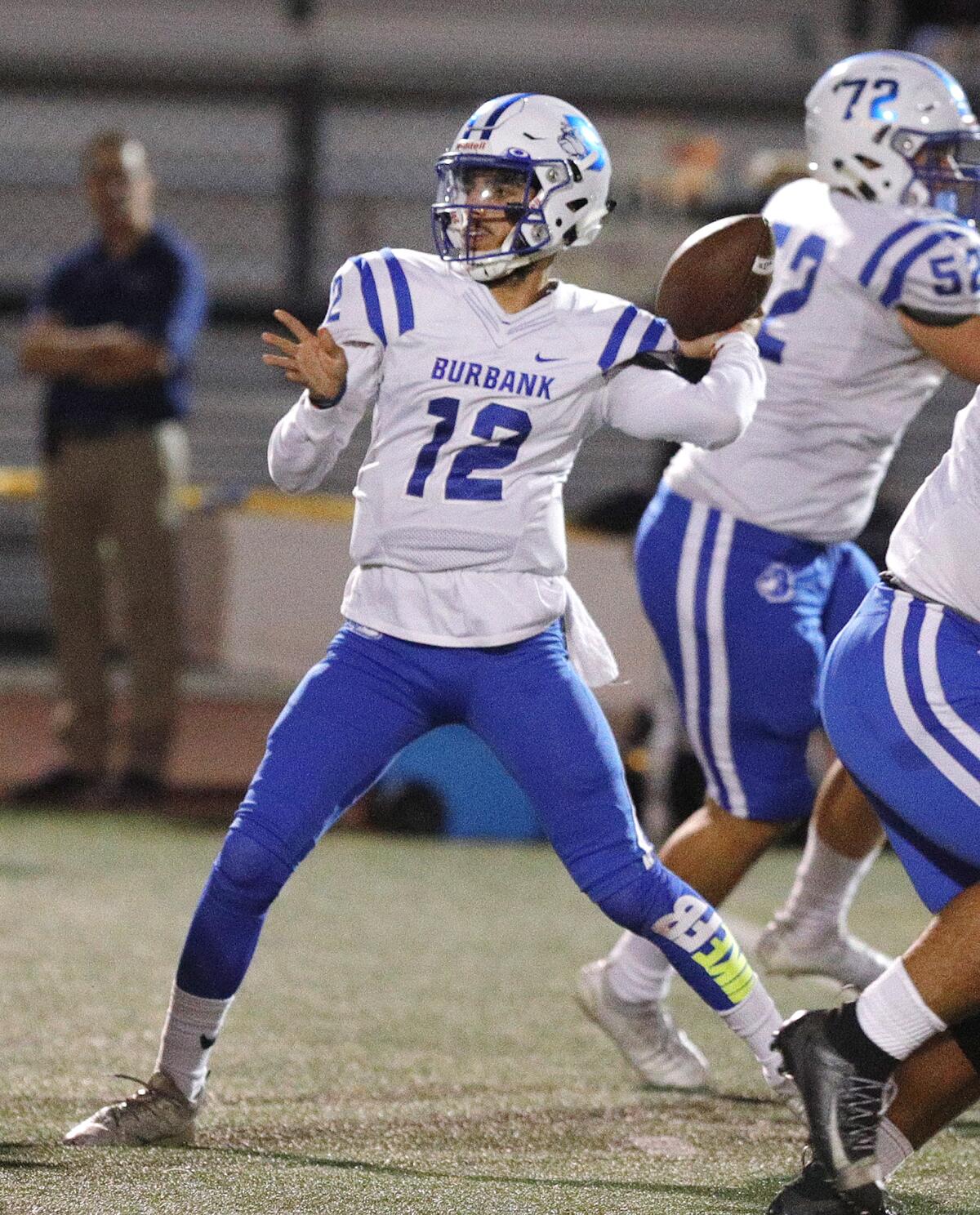 Burbank's quarterback Aram Araradian leans back and throws far downfield against Arcadia in a Pacific League football opener at Arcadia High School on Thursday, September 19, 2019.