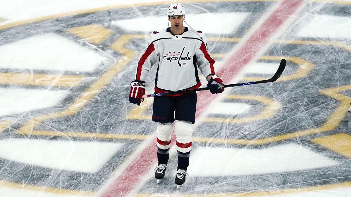 Washington Capitals defenseman Zdeno Chara, skates across the Boston Bruins' logo during a pre-game warm up prior to the first period of an NHL hockey game against his former team, Wednesday, March 3, 2021, in Boston. Chara played for the Bruins from 2006 through the 2020 season. (AP Photo/Charles Krupa)