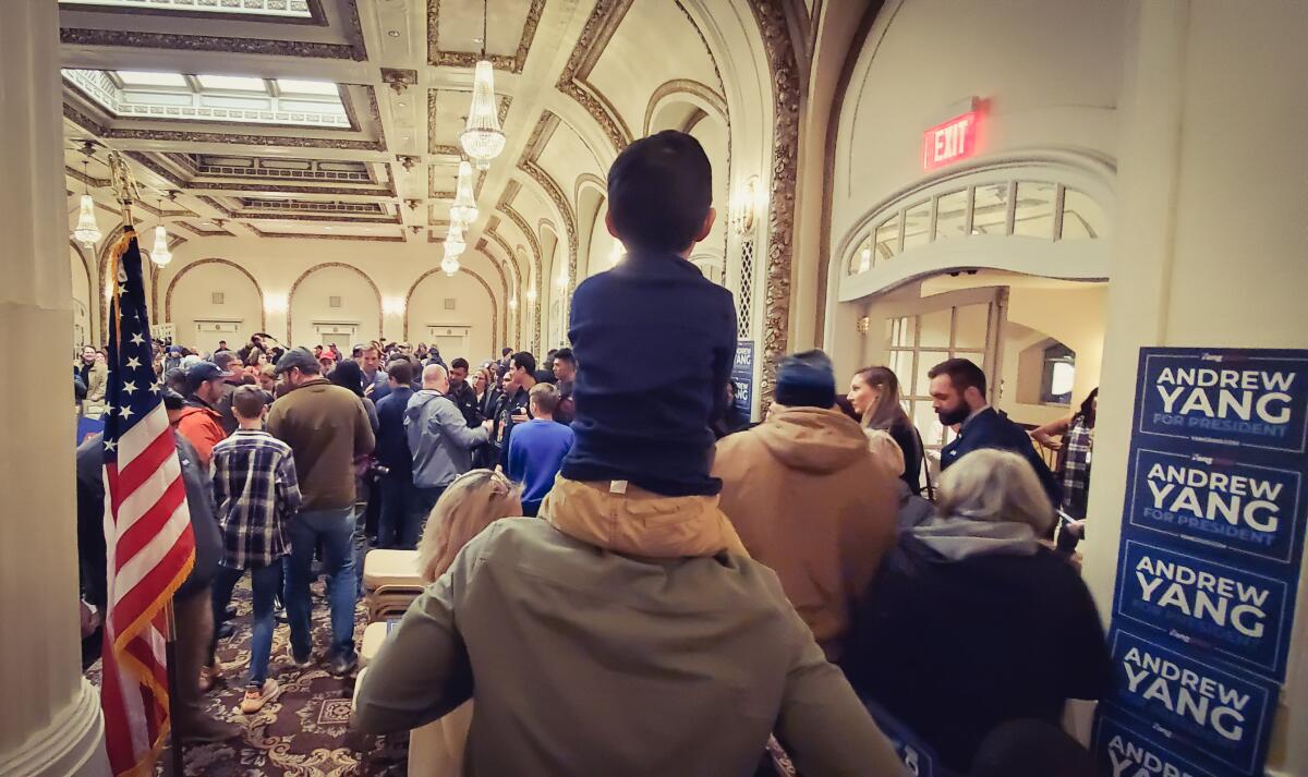 Damian Yang, 4, watches his dad, Andrew Yang, in Davenport, Iowa.