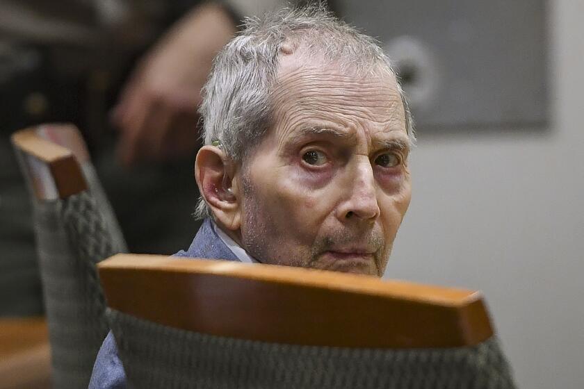 Real estate heir Robert Durst sits during his murder trial at the Airport Branch Courthouse in Los Angeles on Thursday, March 5, 2020. After a Hollywood film about him, an HBO documentary full of seemingly damning statements, and decades of suspicion, Durst is now on trial for murder. In opening statements Wednesday, prosecutors will argue Durst killed his close friend Susan Berman before New York police could interview her about the 1982 disappearance of Durst's wife. (Robyn Beck/AFP via AP, Pool)
