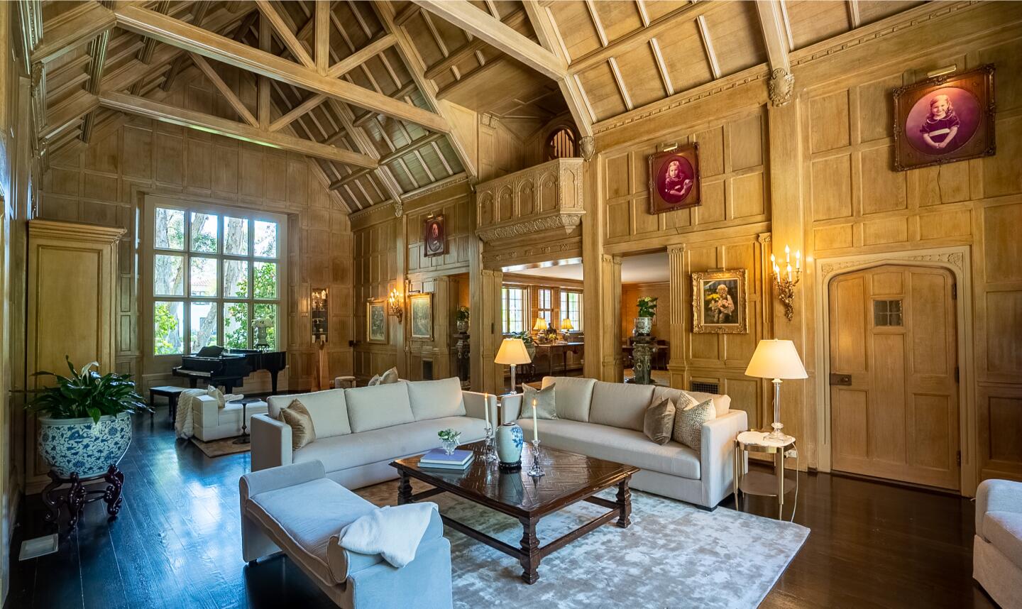 Built in 1924, the English Tudor Revival features brick, stone, teak and dramatic living spaces under 24-foot ceilings.