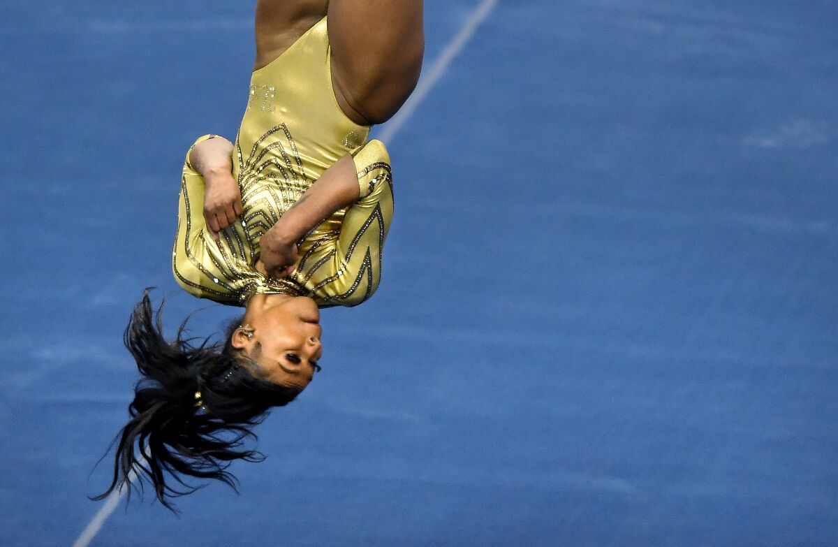 UCLA's Nia Dennis performs her floor routine against Brigham Young at Pauley Pavilion on Feb. 10, 2021.