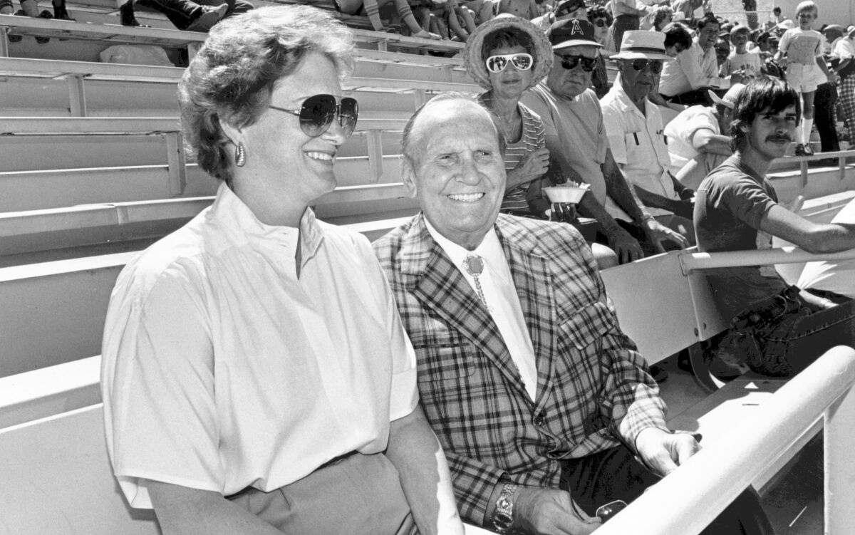 Angels owner Gene Autry sits alongside his wife, Jackie, during a 1984 spring training game in Palm Springs.