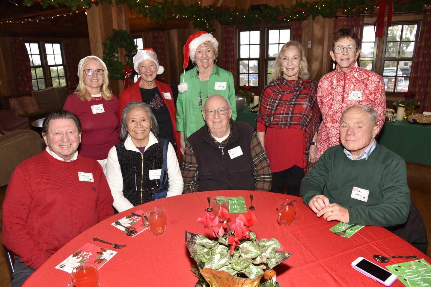 Holiday luncheon committee member/Founding DMCC member Nancy Weare, committee members Barbara Paulovich and Fran Banker, Barbara Healy, Carol Poole. Seated: Thomas Greco, Nancy and Alan Marchand, John Healy