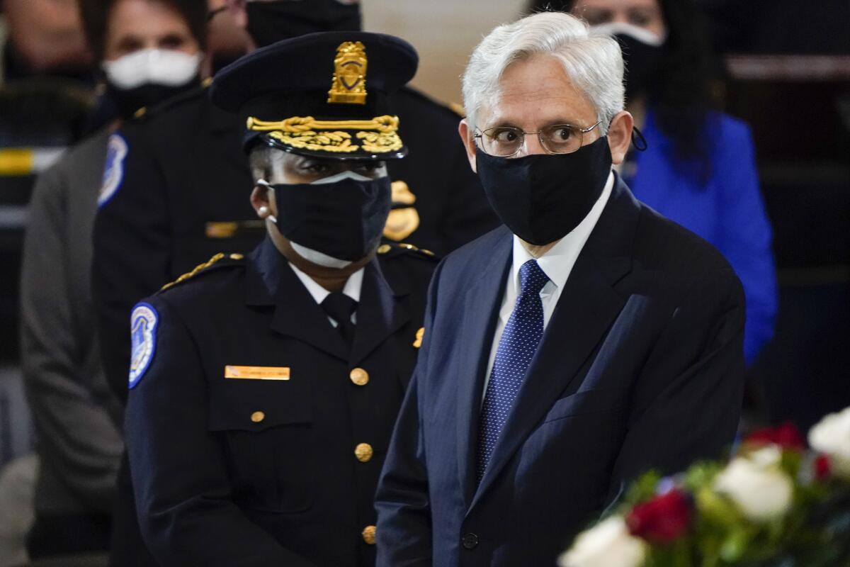 Attorney General Merrick Garland and acting U.S. Capitol Police chief Yogananda Pittman