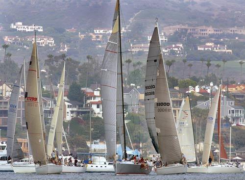 Sailboats race in the Thursday night beer can race in Newport Harbor in Newport Beach. The Harbor Patrol is trying to crack down on speed in the harbor and is clashing with the sailors.