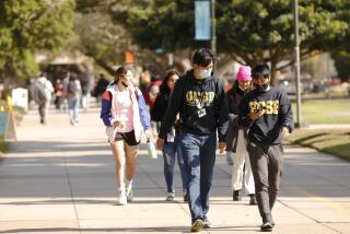 SANTA BARBARA, CA - NOVEMBER 09: Students on the UCSB campus in Santa Barbara as some students face a statewide student housing crisis. Some UC Santa Barbara students are forced to live in vehicles and hotels under temporary contracts due to expire next month. The crisis led the campus to move forward with a plan to build a massive 4,500-bed dorm with tiny rooms and few windows - dubbed "Dormzilla" - which sparked widespread student protests, national headlines and the resignation of the consulting architect. UC Santa Barbara on Tuesday, Nov. 9, 2021 in Santa Barbara, CA. (Al Seib / Los Angeles Times).