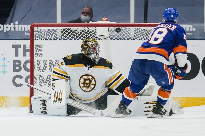 New York Islanders' Anthony Beauvillier (18) shoots the puck past Boston Bruins goaltender Jaroslav Halak (41) during the shootout period of an NHL hockey game Tuesday, March 9, 2021, in Uniondale, N.Y. The Islanders won 2-1. (AP Photo/Frank Franklin II)