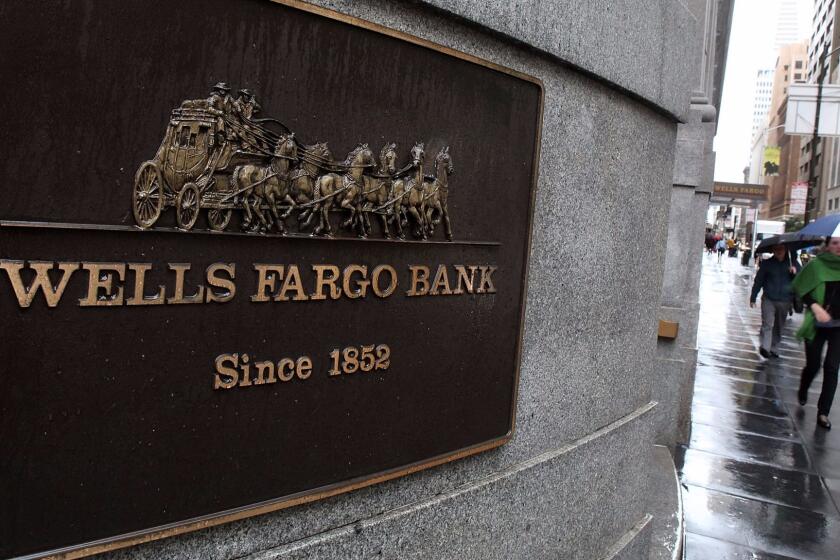 FILE - APRIL 13, 2017: Wells Fargo has reported flat first quarter earnings, reporting a profit of $5.46 billion, or $1 a share, compared to $5.46 billion or 99 cents a share in the same period of last year. SAN FRANCISCO - JANUARY 20: Pedestrians walk by a Wells Fargo Bank branch office January 20, 2010 in San Francisco, California. Wells Fargo beat analyst expectations by posting a fourth quarter earnings of $2.82 billion or 8 cents a share compared to a loss of $2.73 billion or 84 cents a share one year ago. (Photo by Justin Sullivan/Getty Images) ** OUTS - ELSENT, FPG, CM - OUTS * NM, PH, VA if sourced by CT, LA or MoD **