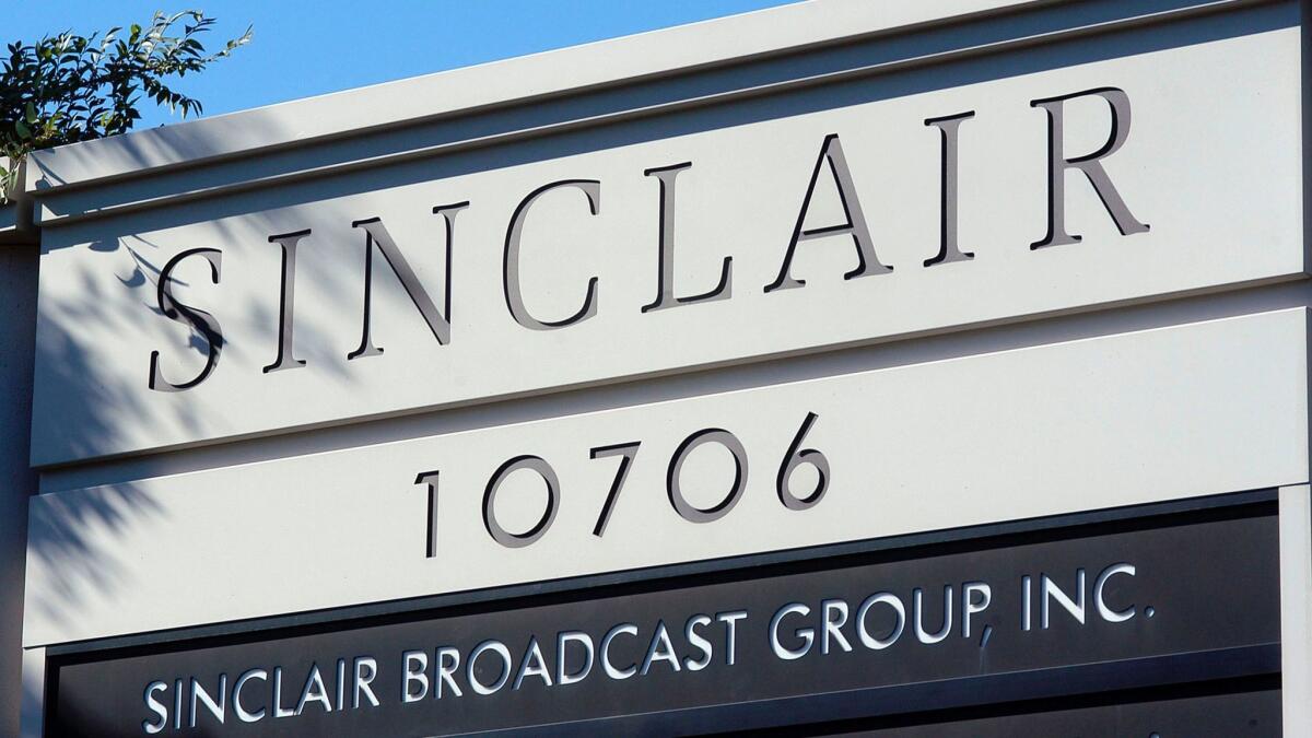 A sign for the Sinclair Broadcast Group building is seen in a business district in Hunt Valley, Md.