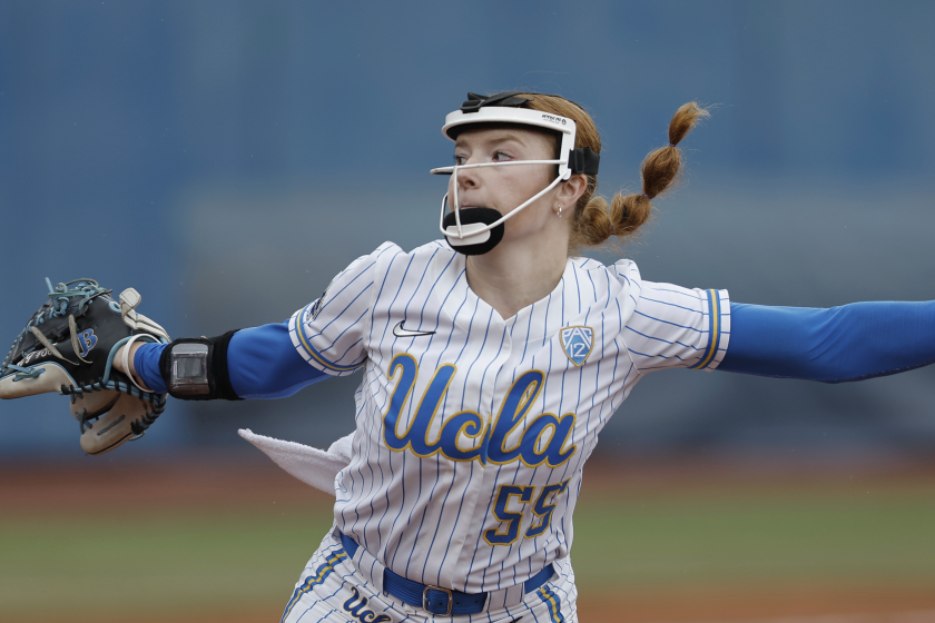UCLA starting pitcher Kaitlyn Terry (55) throws during an NCAA softball Women's College World Series.