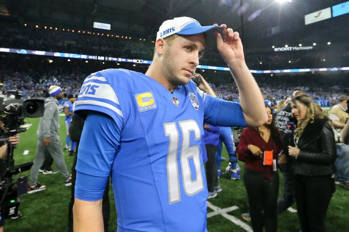 Detroit quarterback Jared Goff touches his cap and walks off the field after Detroit defeated the Rams 