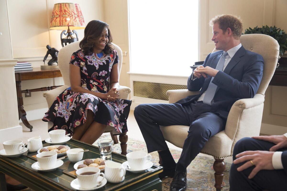 U.S. First Lady Michelle Obama meets with Prince Harry for tea on Tuesday to discuss the "Let Girls Learn" initiative and support for veterans.