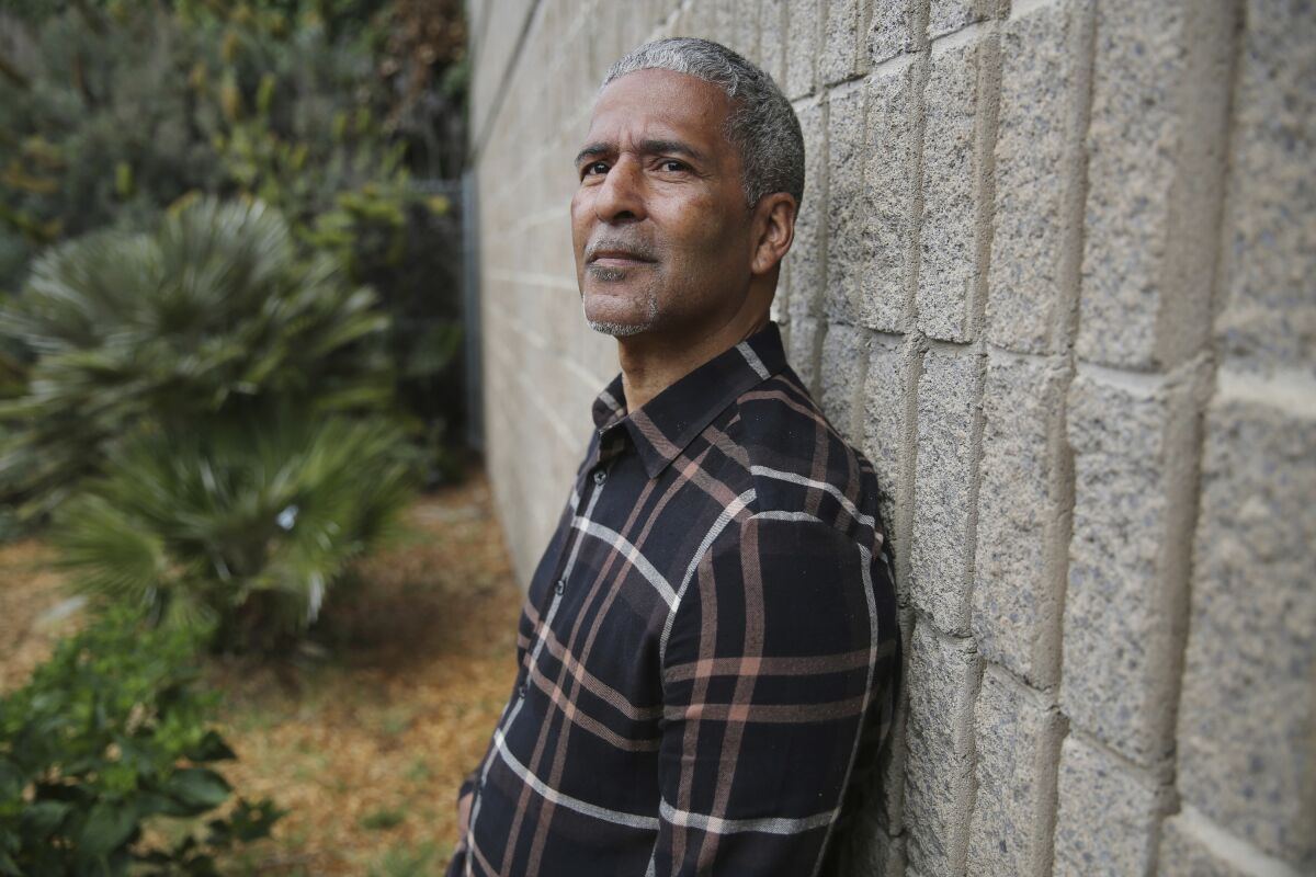 FILE - James Spingola, executive director of the Ella Hill Hutch Community Center and a juvenile probation commissioner for the city, stands for a portrait outside the Ella Hill Hutch Community Center, Friday, June 15, 2018, in San Francisco. Spingola was severely beaten by two allegedly homeless men, Friday, July 15, 2022. (Santiago Mejia/San Francisco Chronicle via AP, File)