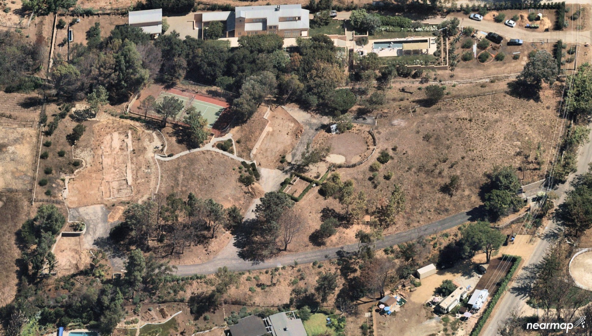 The four-plus-acre property near Zuma Beach was the site of a European-inspired farmhouse. The Doug Burdge-designed home was destroyed by the 2018 Woolsey fire.