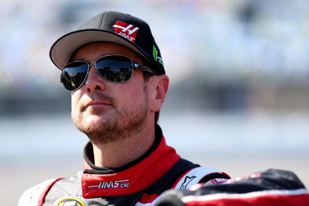 Kurt Busch stands on the grid Sunday during qualifying for the Daytona 500.