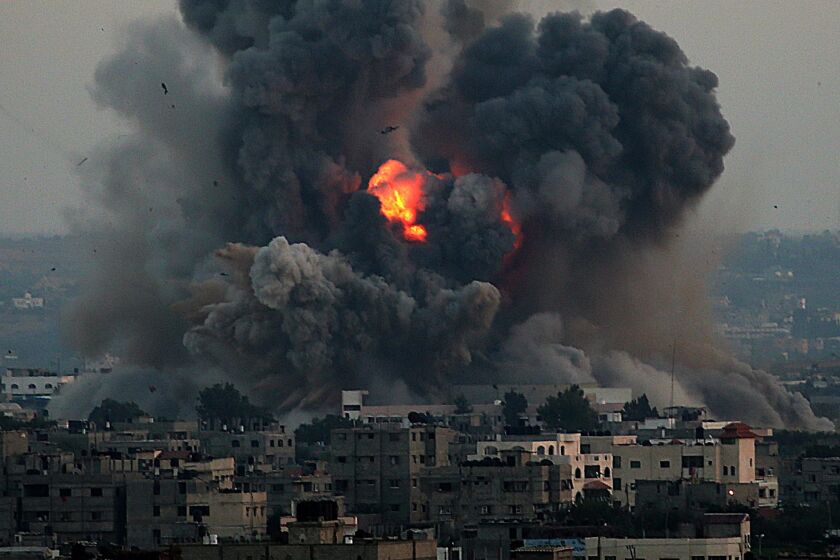 Smoke rises after an Israeli airstrike in the south of Gaza City on July 8.