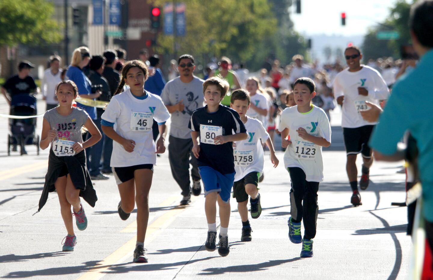 Some of the older children were the firs to finish the 5th annual Burbank Community YMCA Turkey Trot Kids Run in Burbank on Thursday, Nov. 27, 2014.