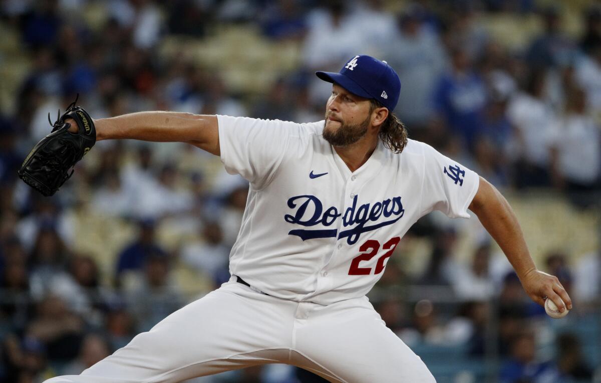 Dodgers starting pitcher Clayton Kershaw delivers against the Giants in the second inning Saturday.