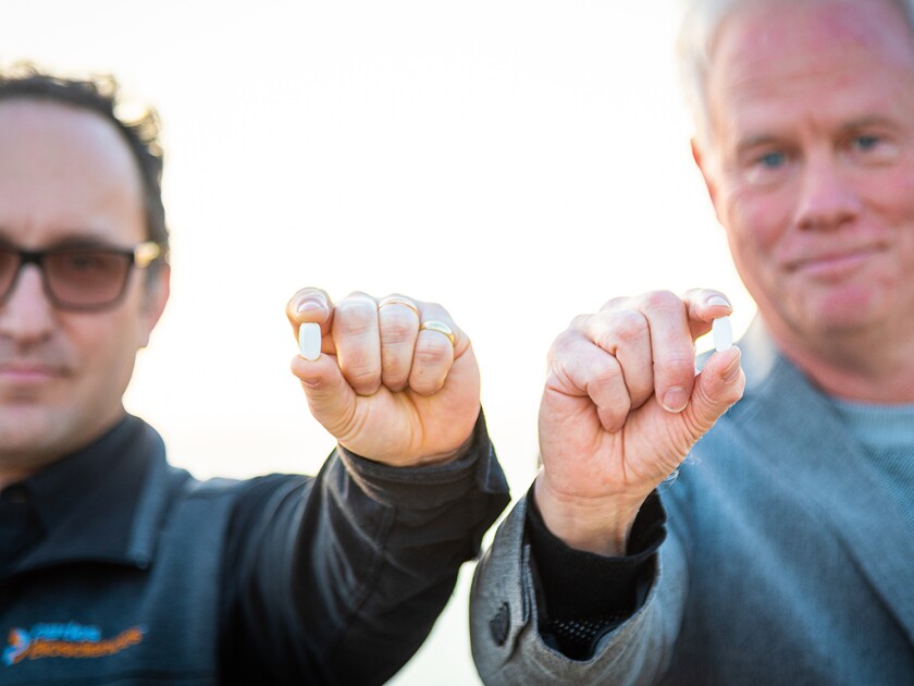 Pardes Biosciences' Uri Lopatin and Lee Arnold hold experimental COVID-19 pills.